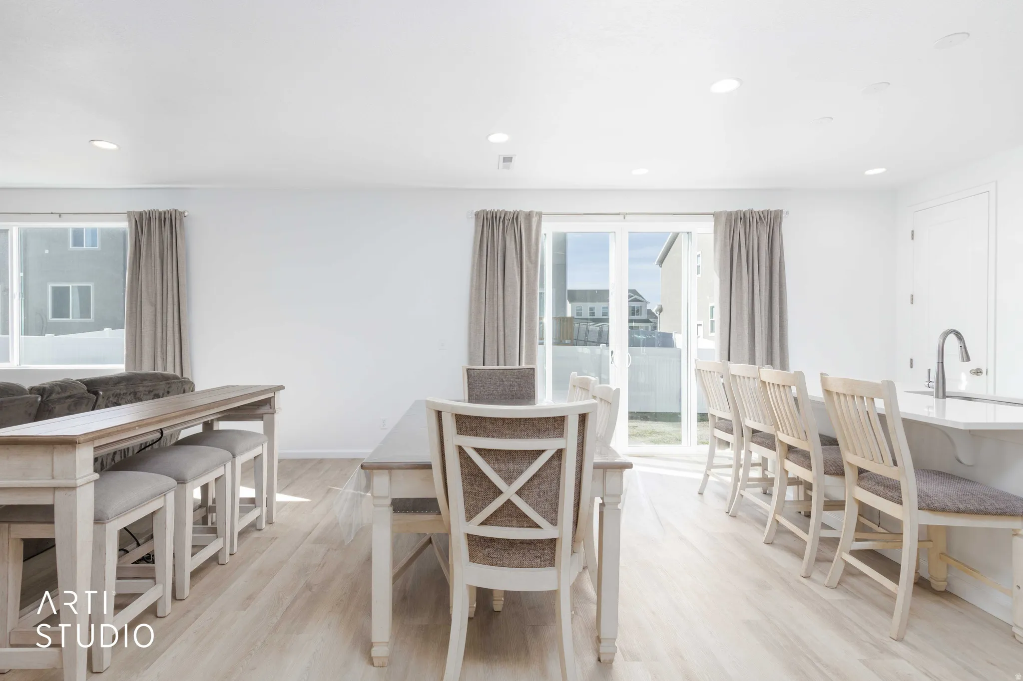 Dining space featuring light wood finished floors and recessed lighting