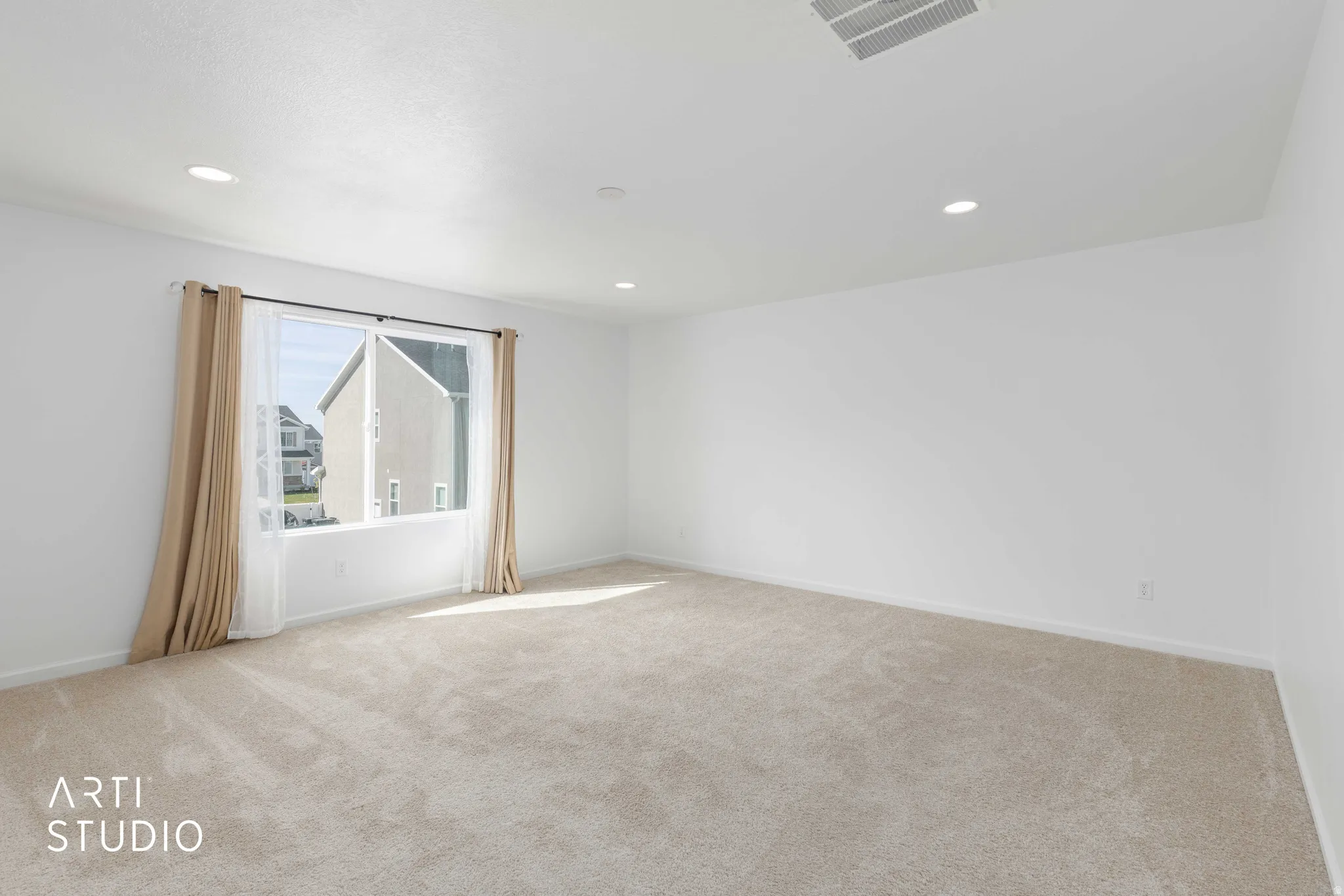 Unfurnished room featuring light colored carpet and recessed lighting