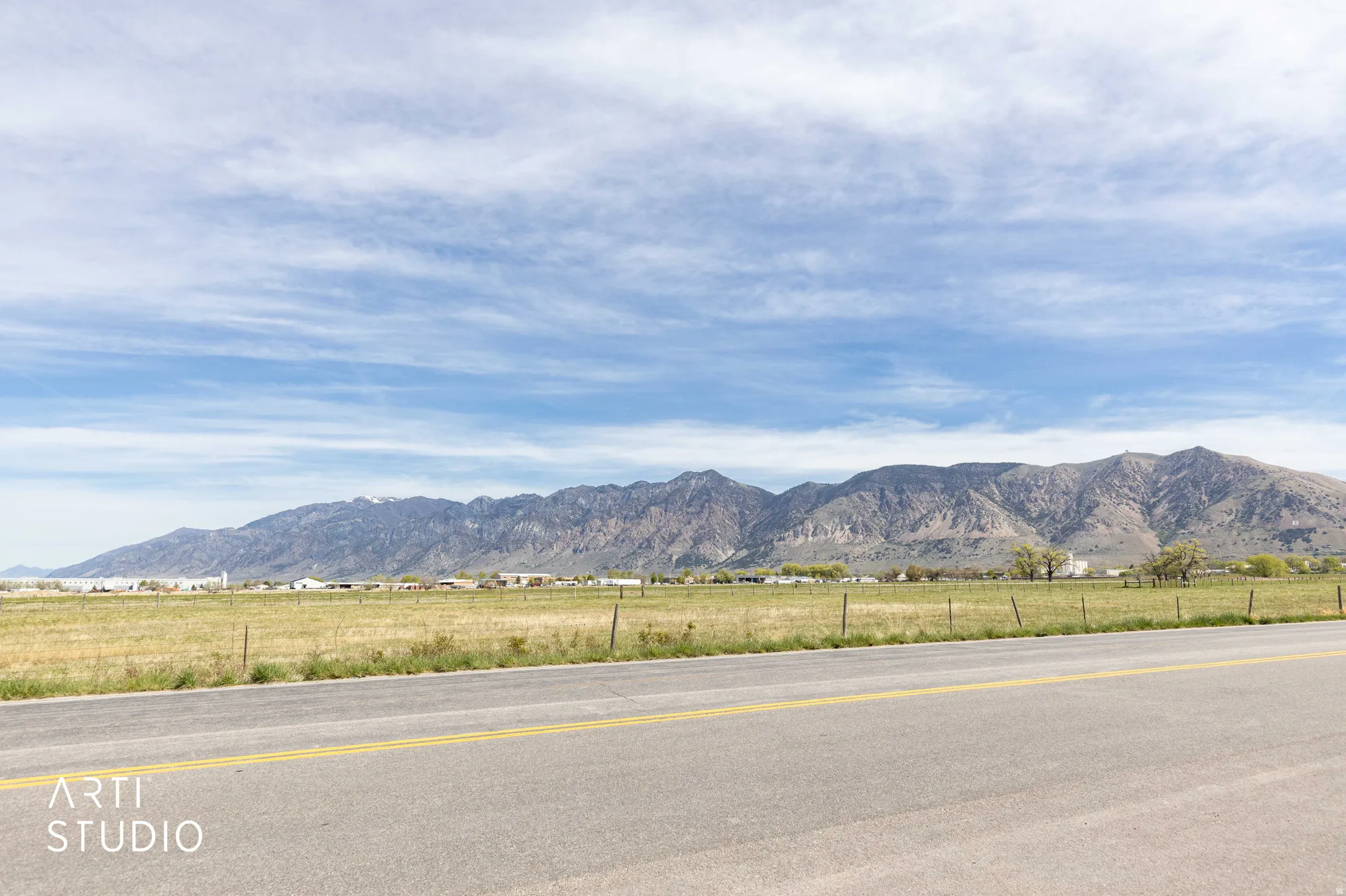 View of mountain background featuring rural landscape
