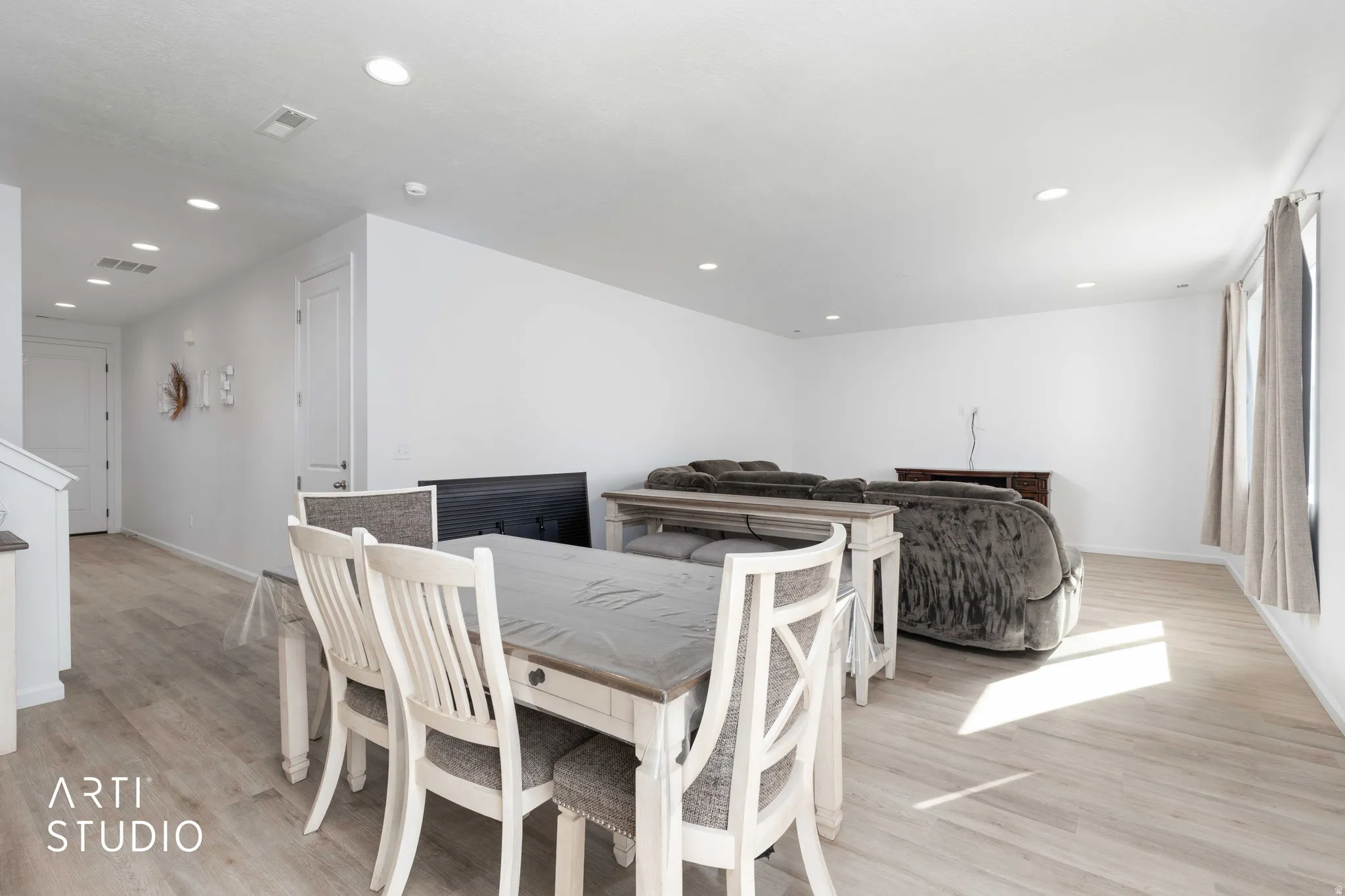 Dining area featuring light wood-style flooring and recessed lighting