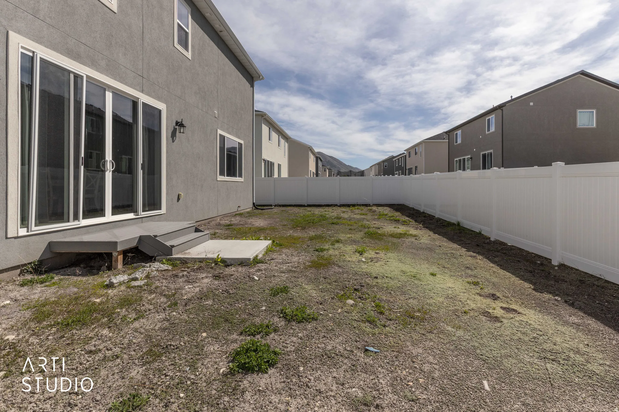 View of fenced backyard