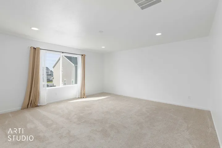 Unfurnished room featuring light colored carpet and recessed lighting