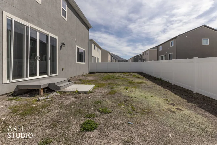 View of fenced backyard