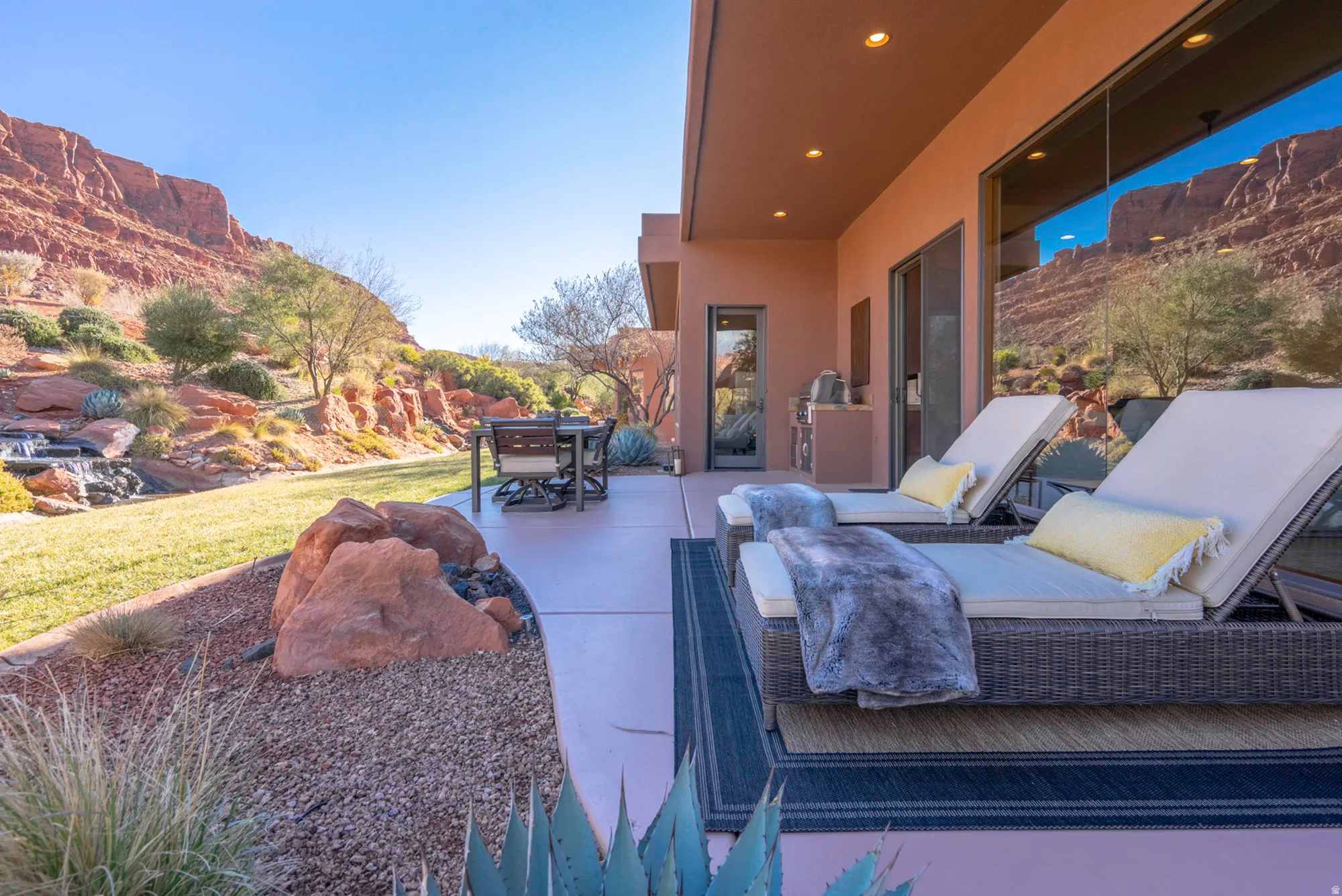 View of patio with outdoor dining area and a mountain view