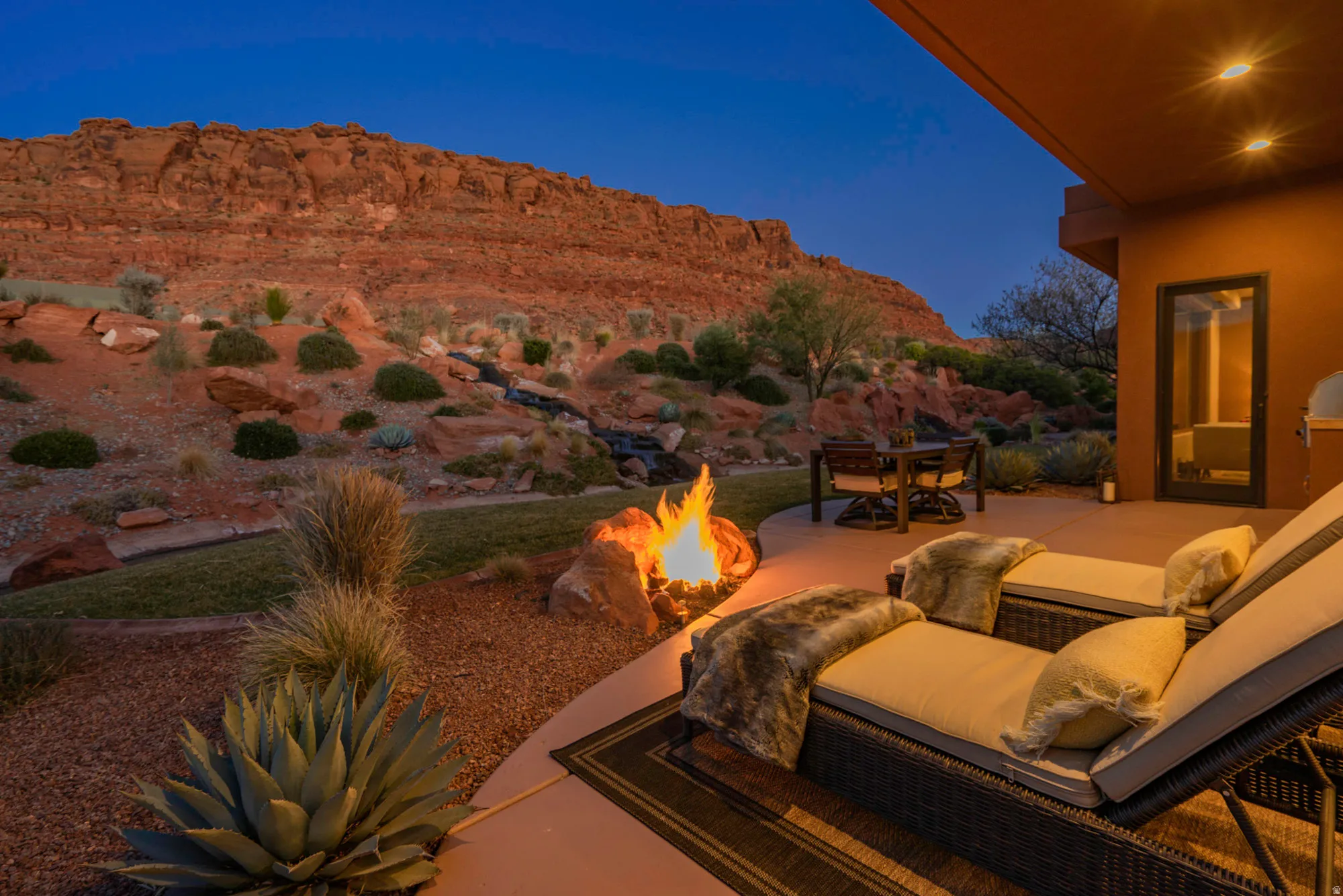 View of patio / terrace with a mountain view, an outdoor fire pit, and outdoor dining space