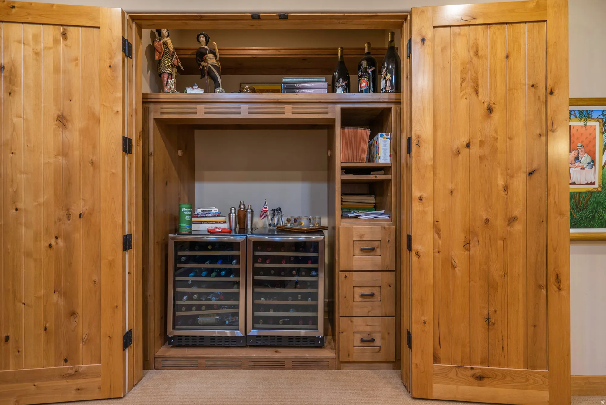 Bar area with carpet flooring and wine cooler