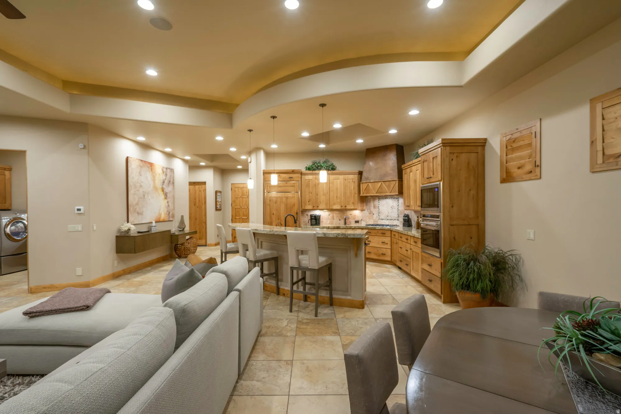 Living area featuring washer / clothes dryer, recessed lighting, light tile patterned floors, and ceiling fan