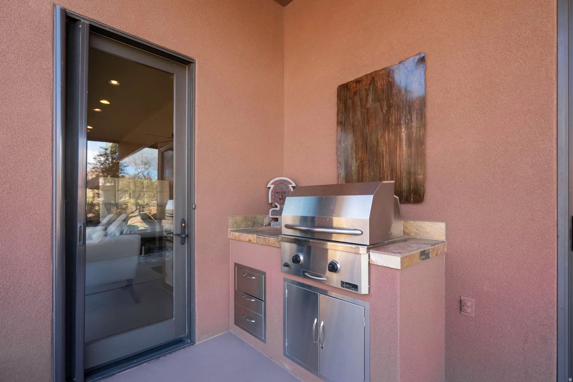 View of patio featuring area for grilling