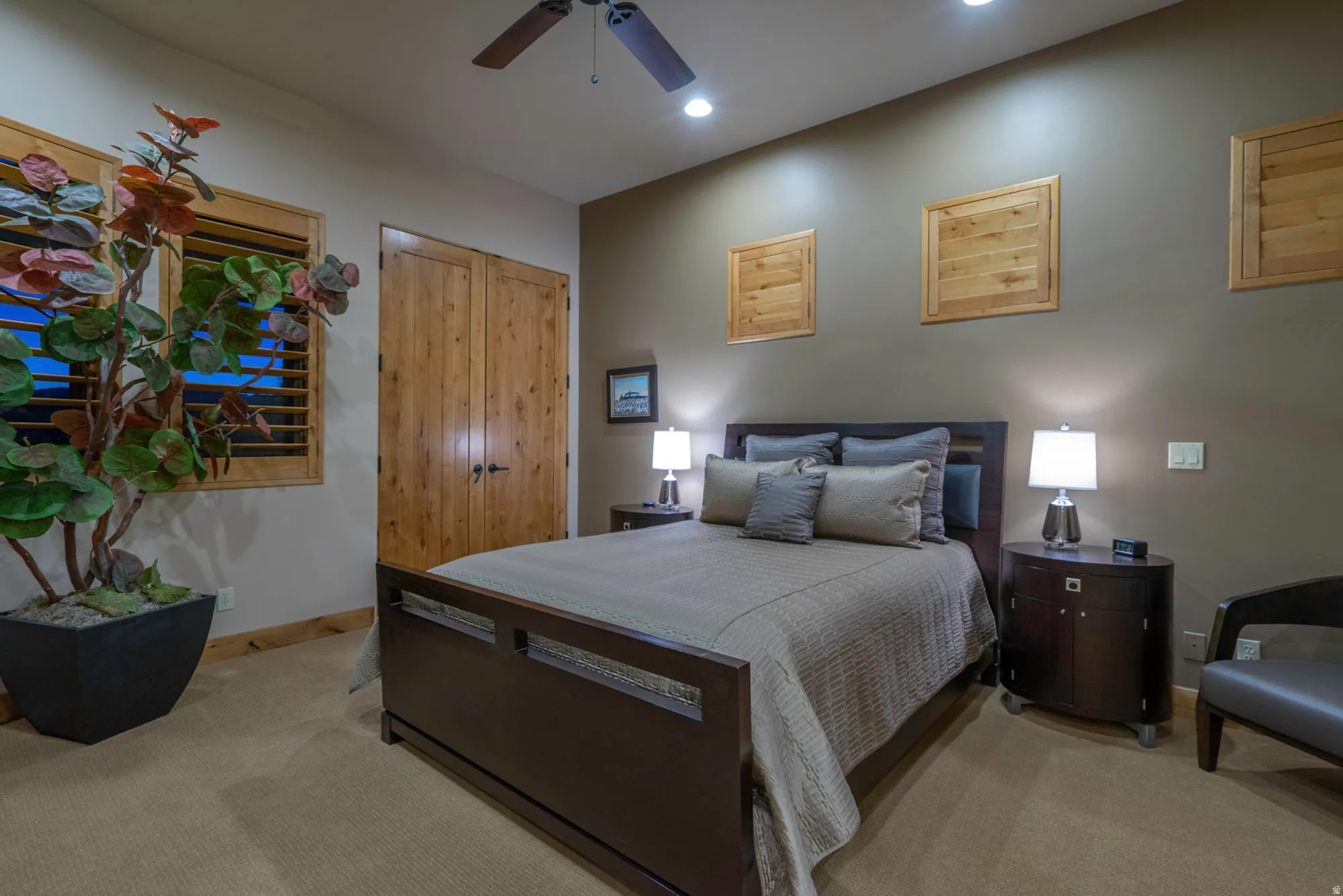 Bedroom featuring a closet, light colored carpet, recessed lighting, and ceiling fan