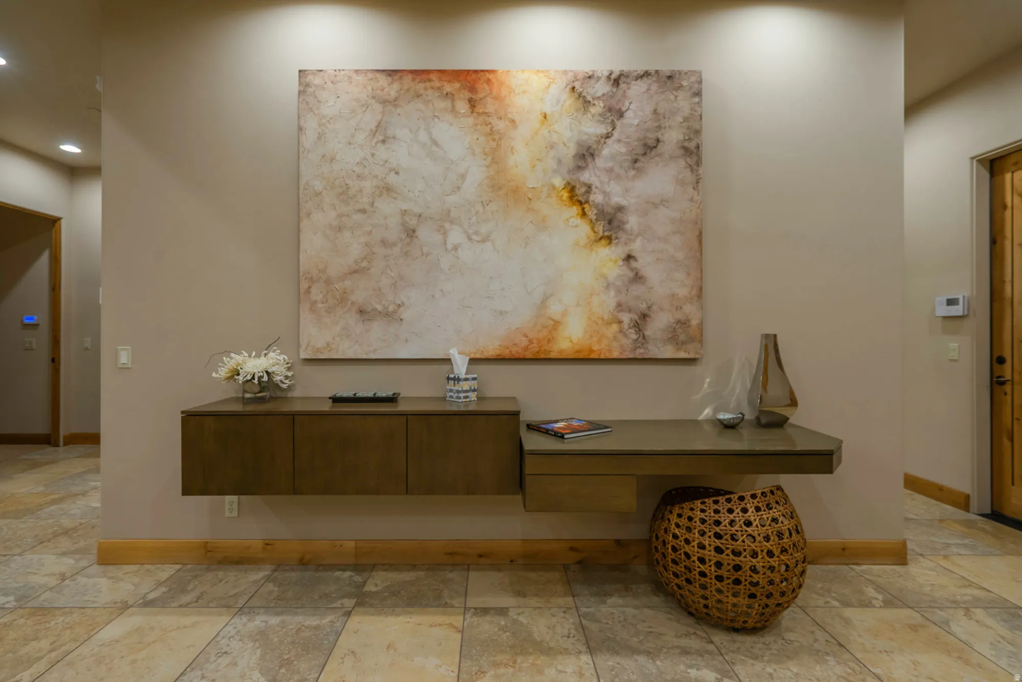 Detailed view of baseboards and recessed lighting