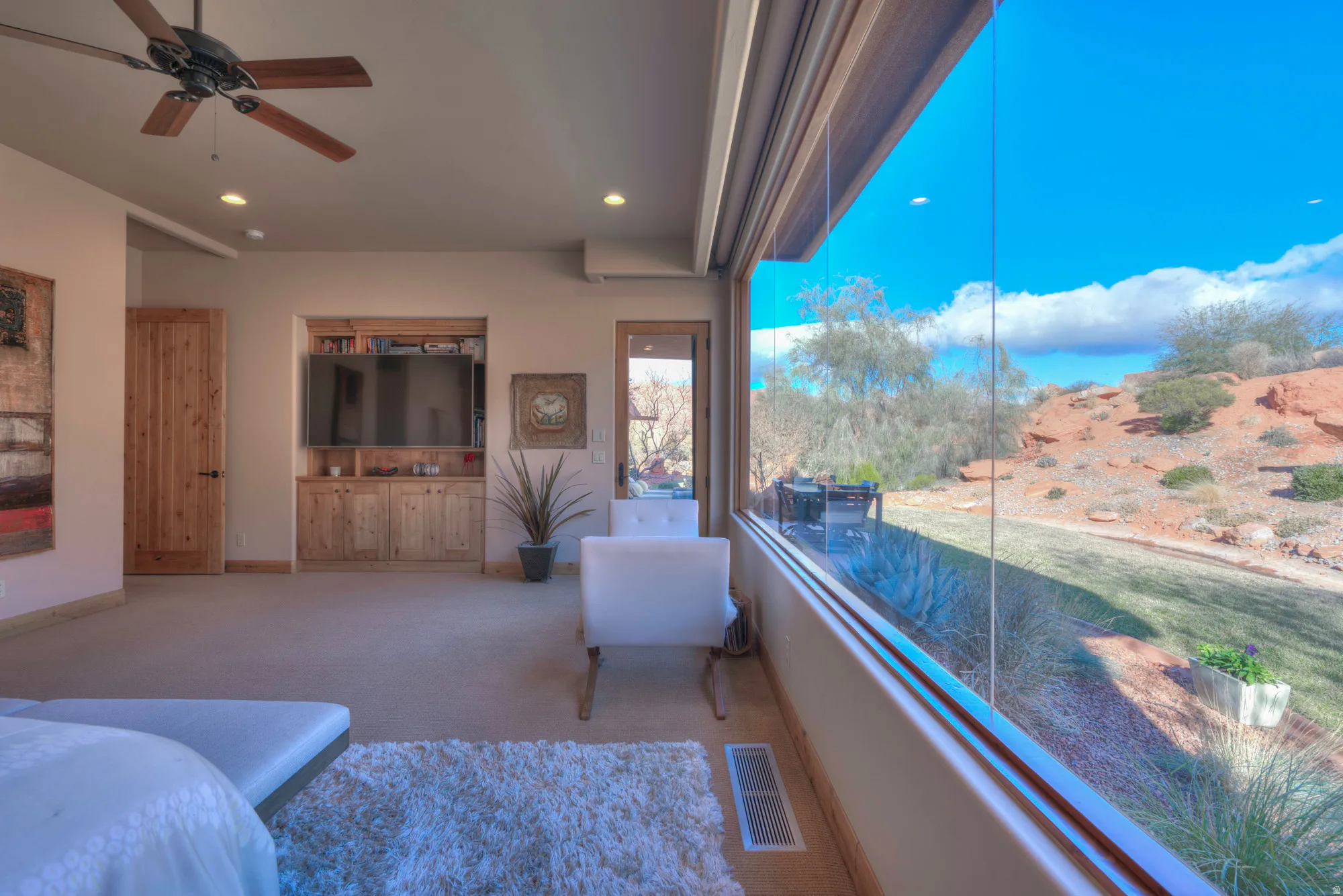 Bedroom featuring carpet floors, ceiling fan, recessed lighting, and access to exterior