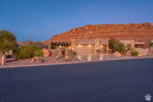 View of front of house featuring an attached garage and driveway