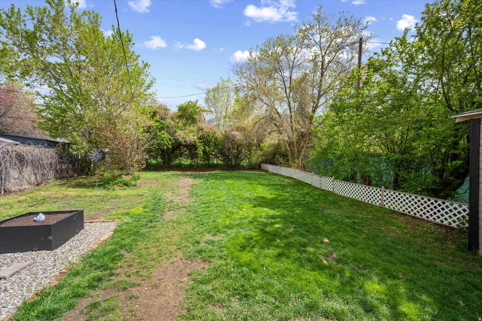 View of fenced backyard