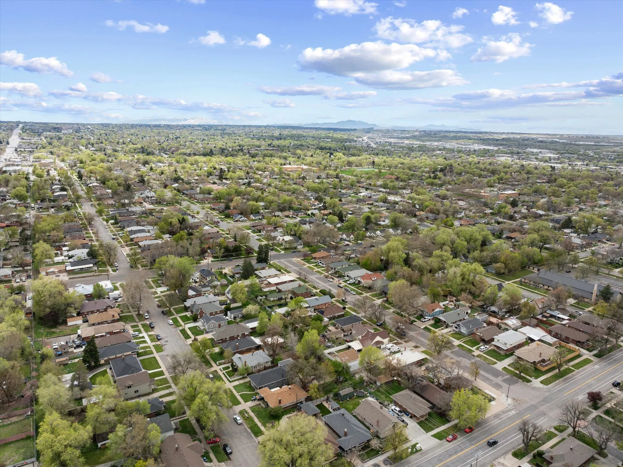 Aerial view of residential area featuring a mountainous background
