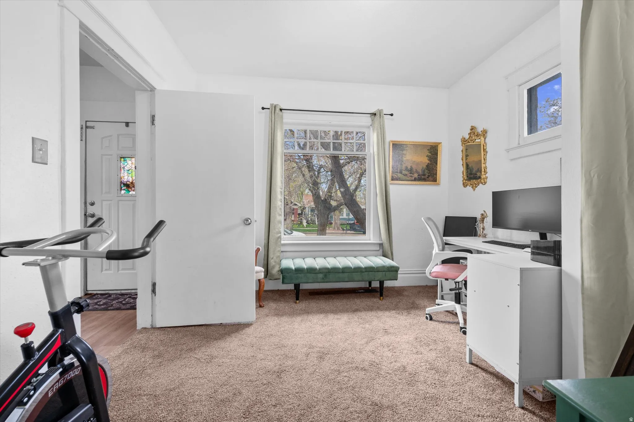 Office area featuring light carpet