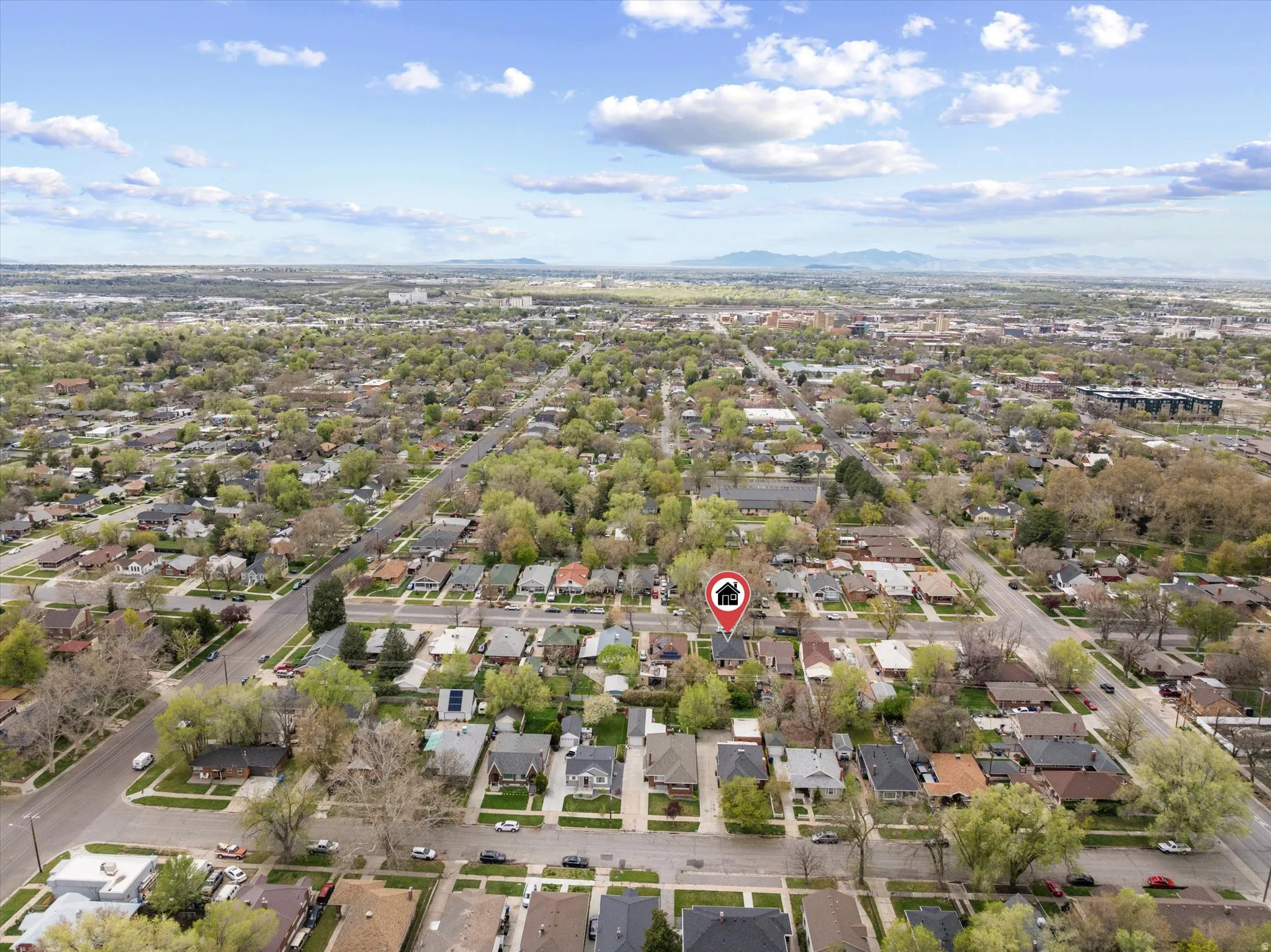 Aerial perspective of suburban area with a mountain backdrop