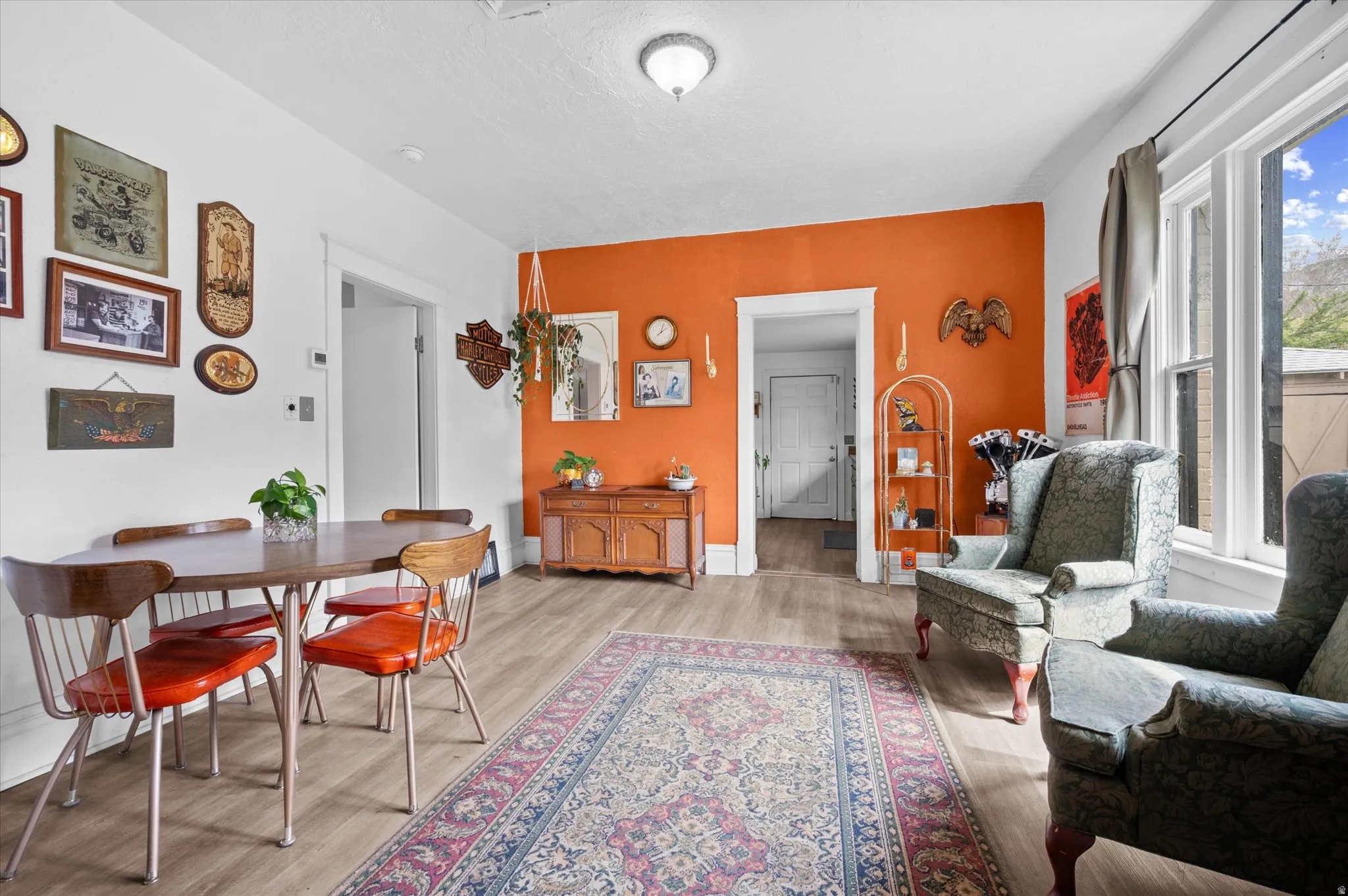 Dining space featuring light wood-style floors and baseboards