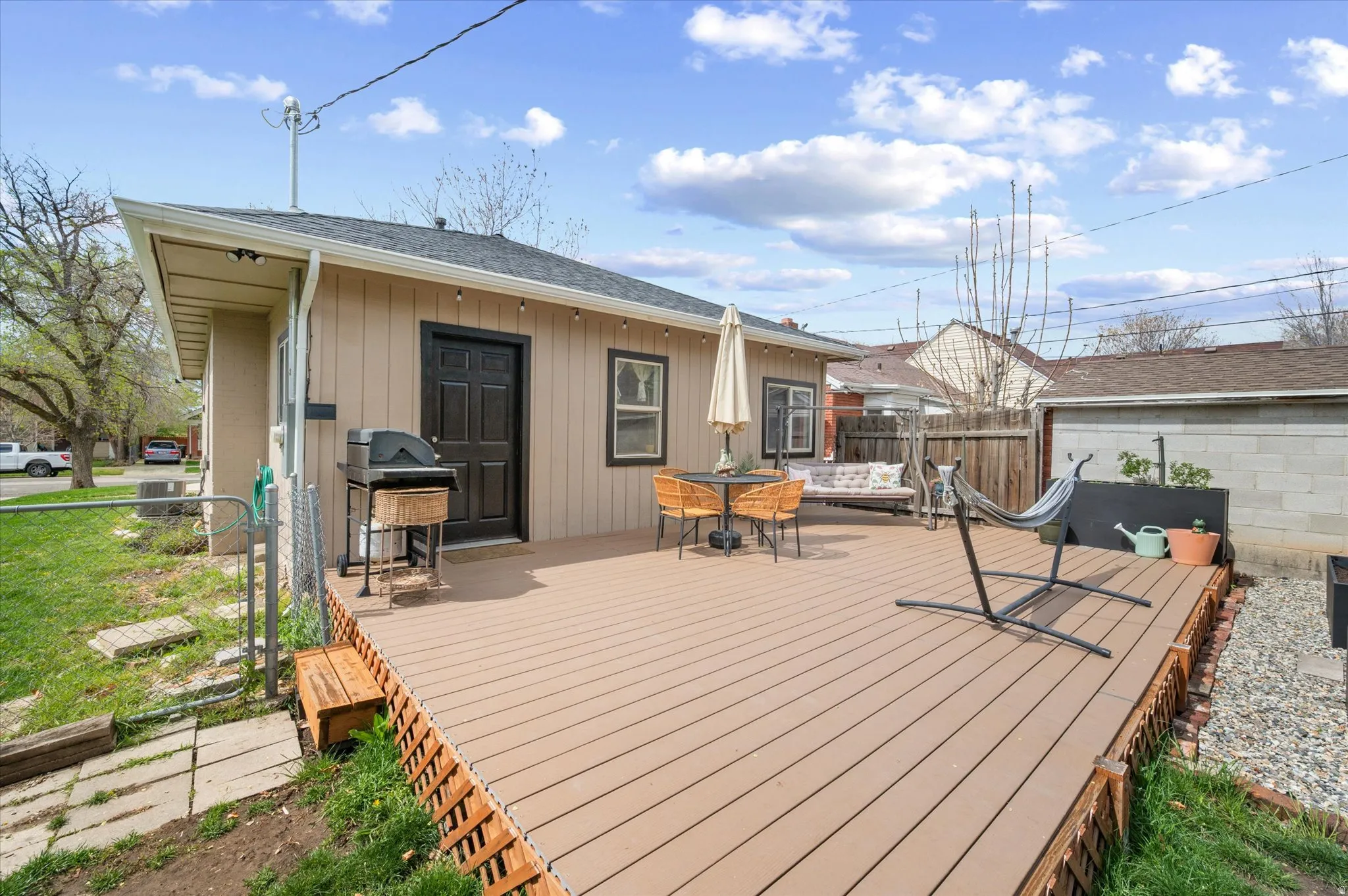 Deck featuring area for grilling and outdoor dining area