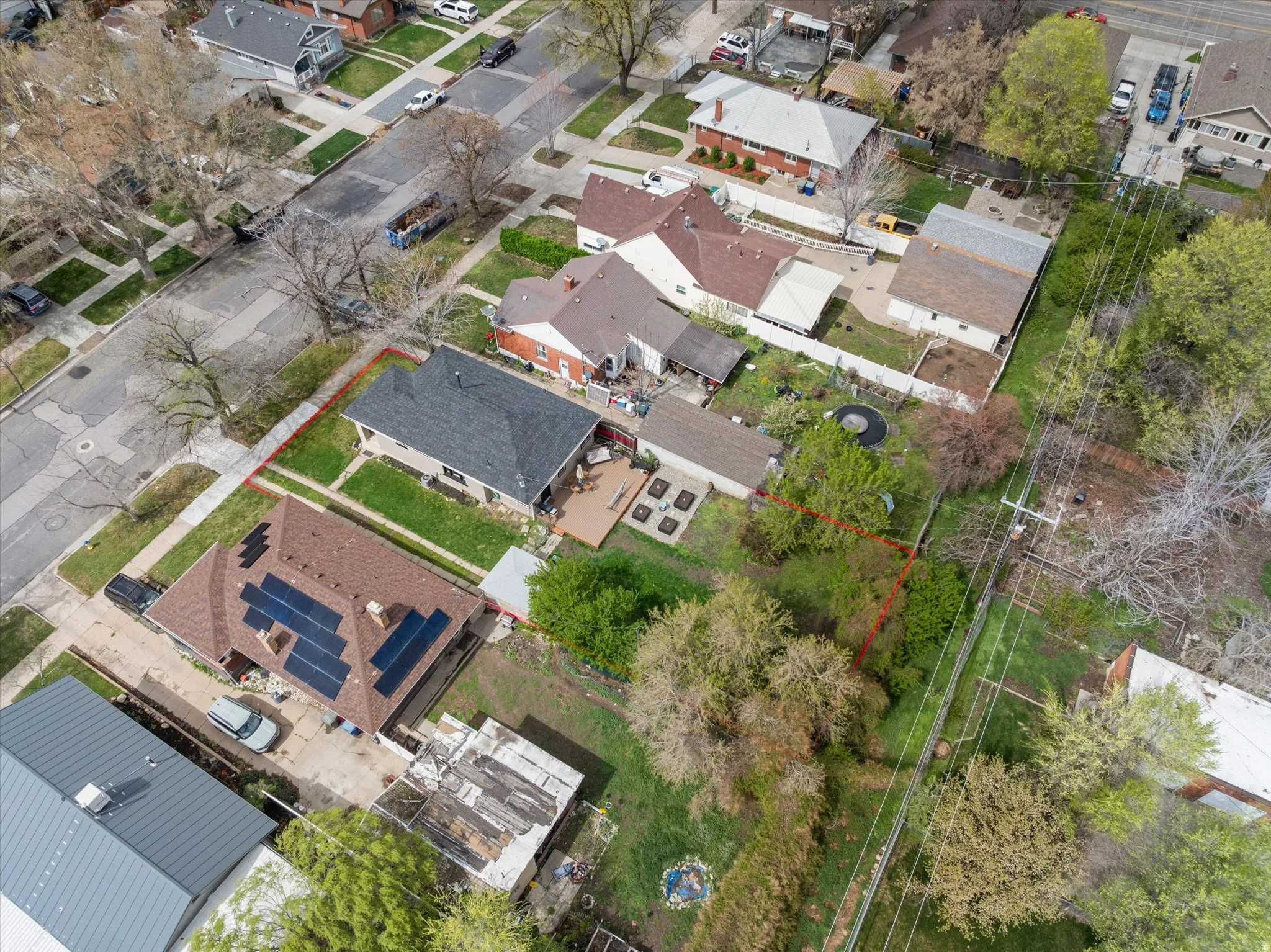 Aerial view of residential area with property parcel outlined