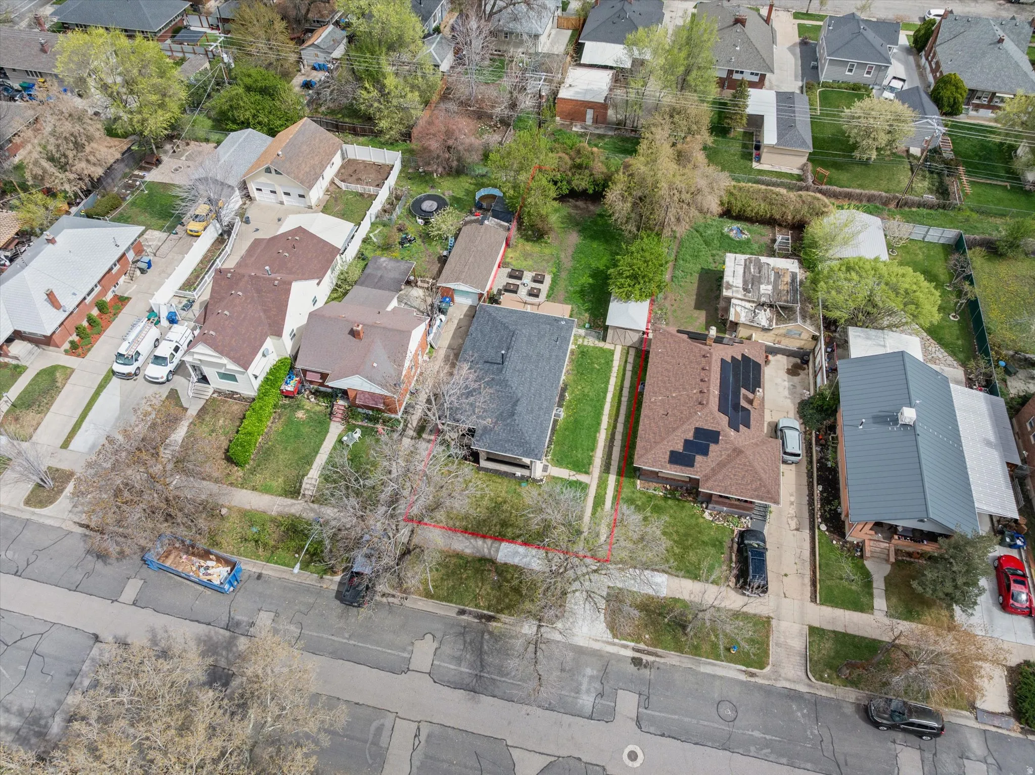 Aerial view of residential area with property parcel outlined
