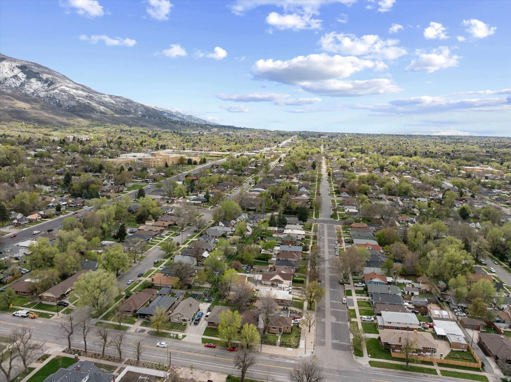 Aerial perspective of suburban area featuring a mountain backdrop