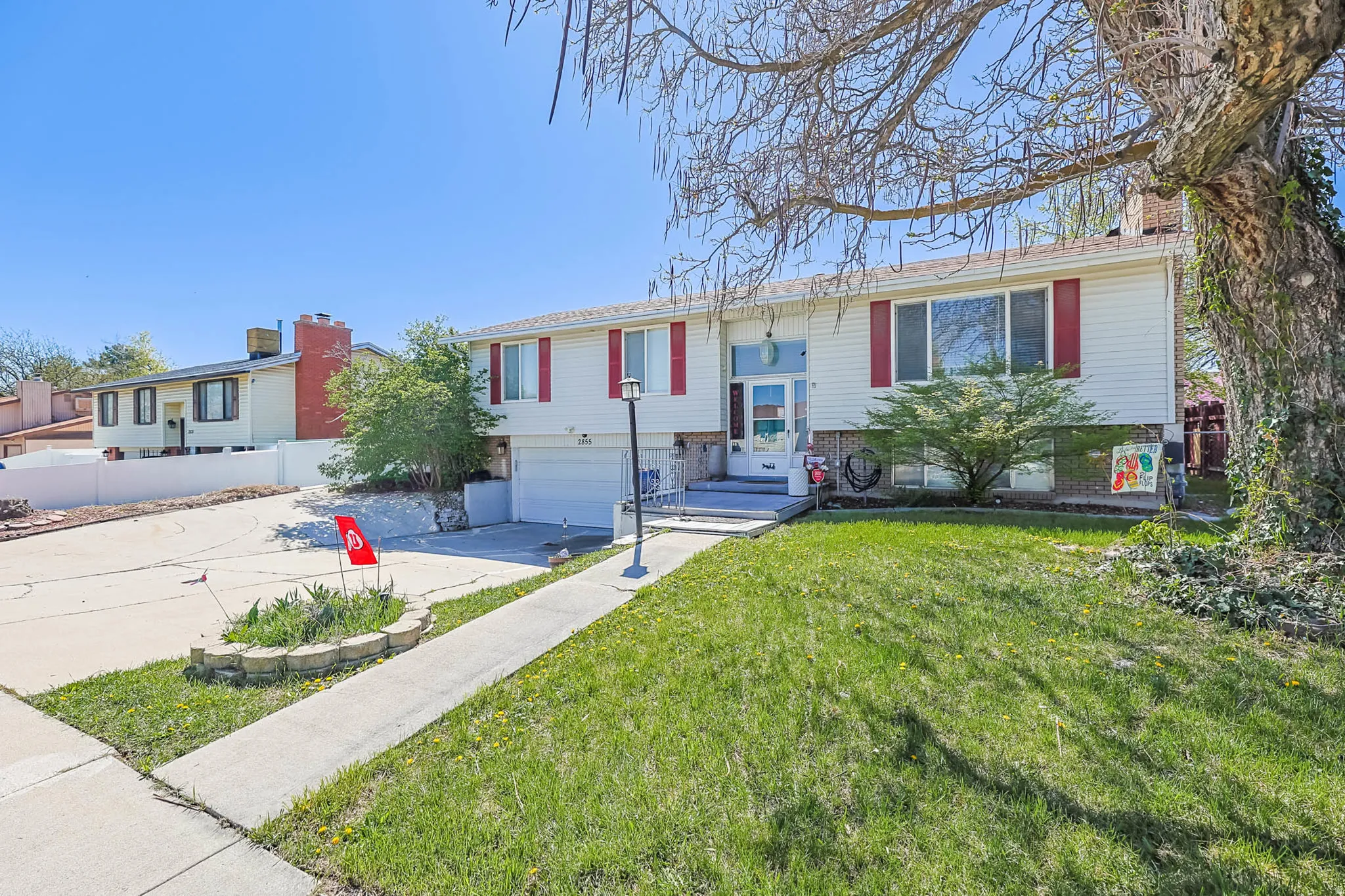 Raised ranch with a garage and driveway