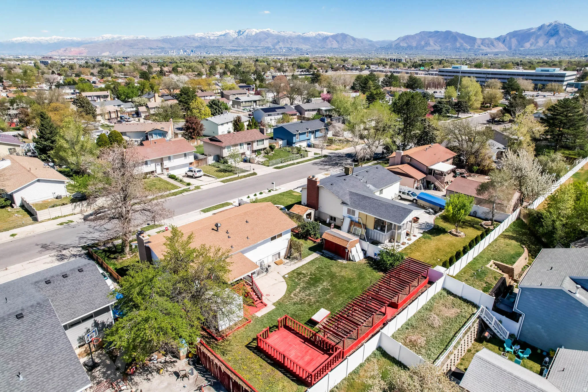 Aerial perspective of suburban area featuring a mountain backdrop