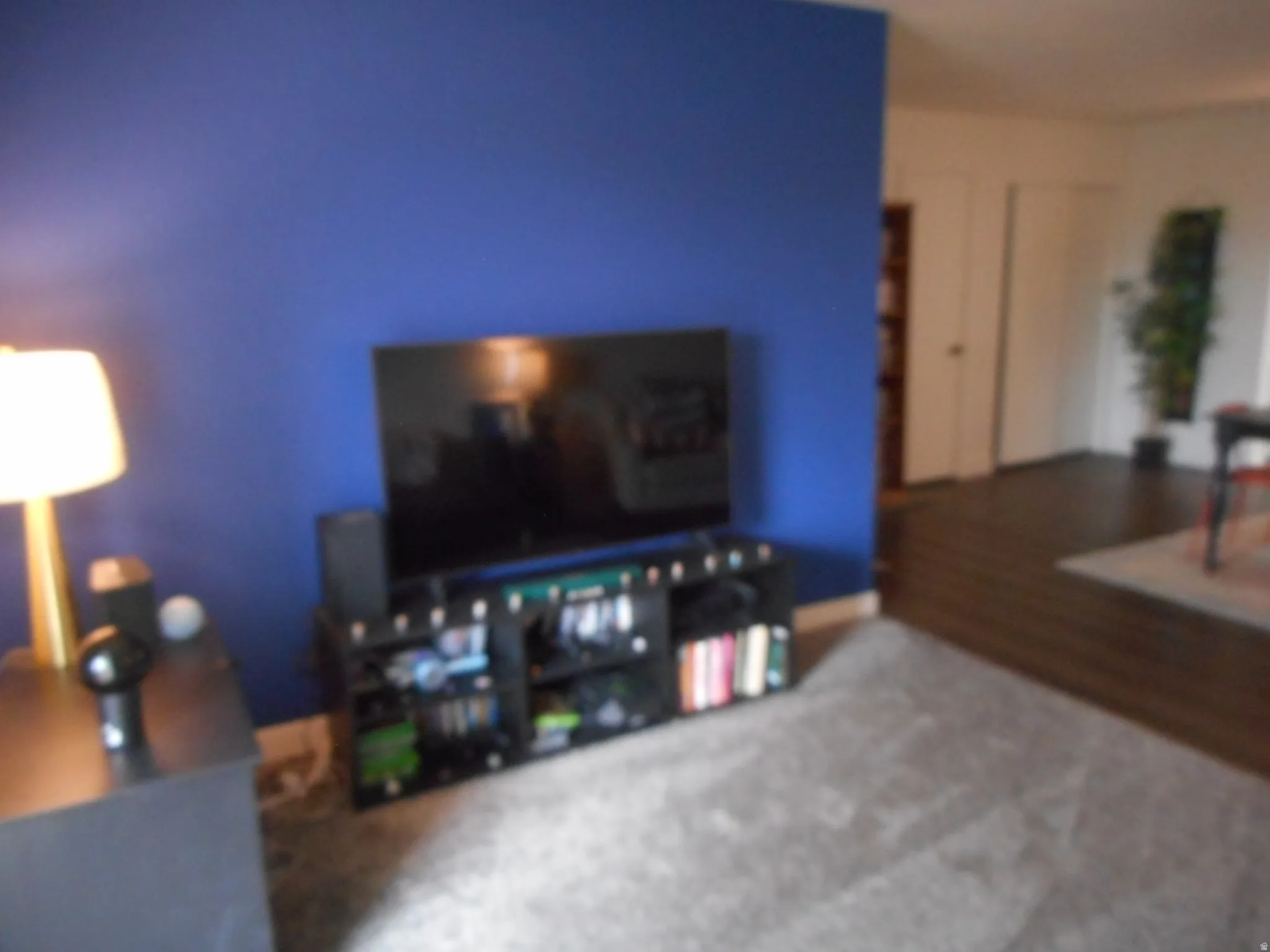 Living room with carpet and baseboards