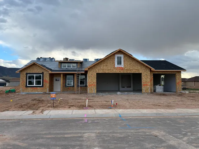 Front view of property in mid-construction featuring front porch