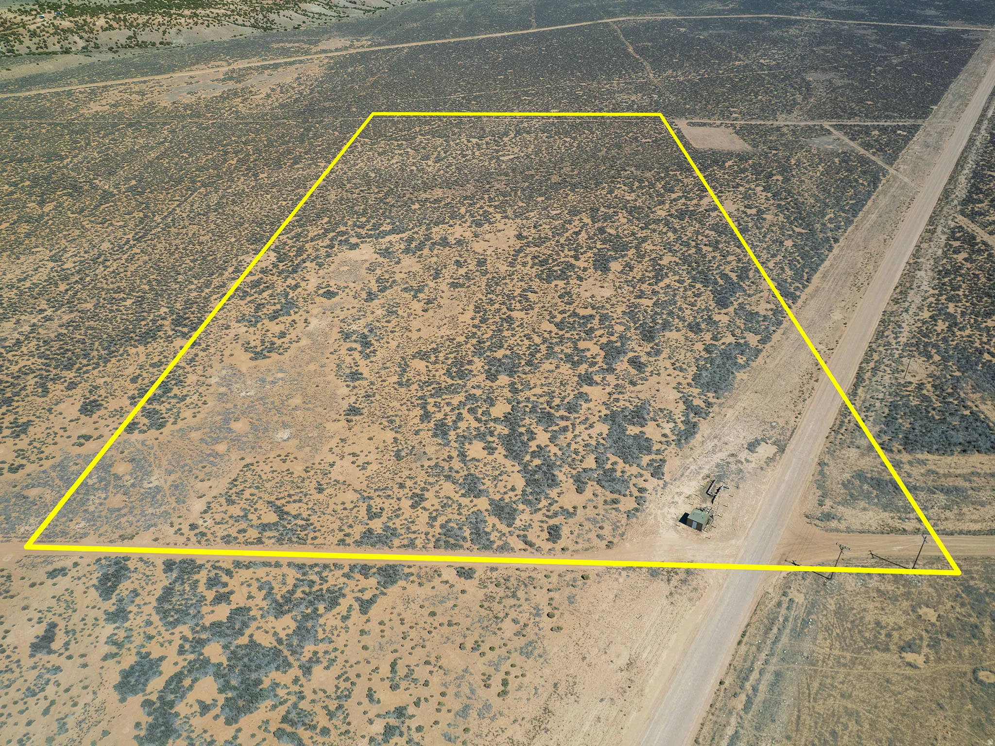 View of rural area with a desert landscape and property parcel outlined