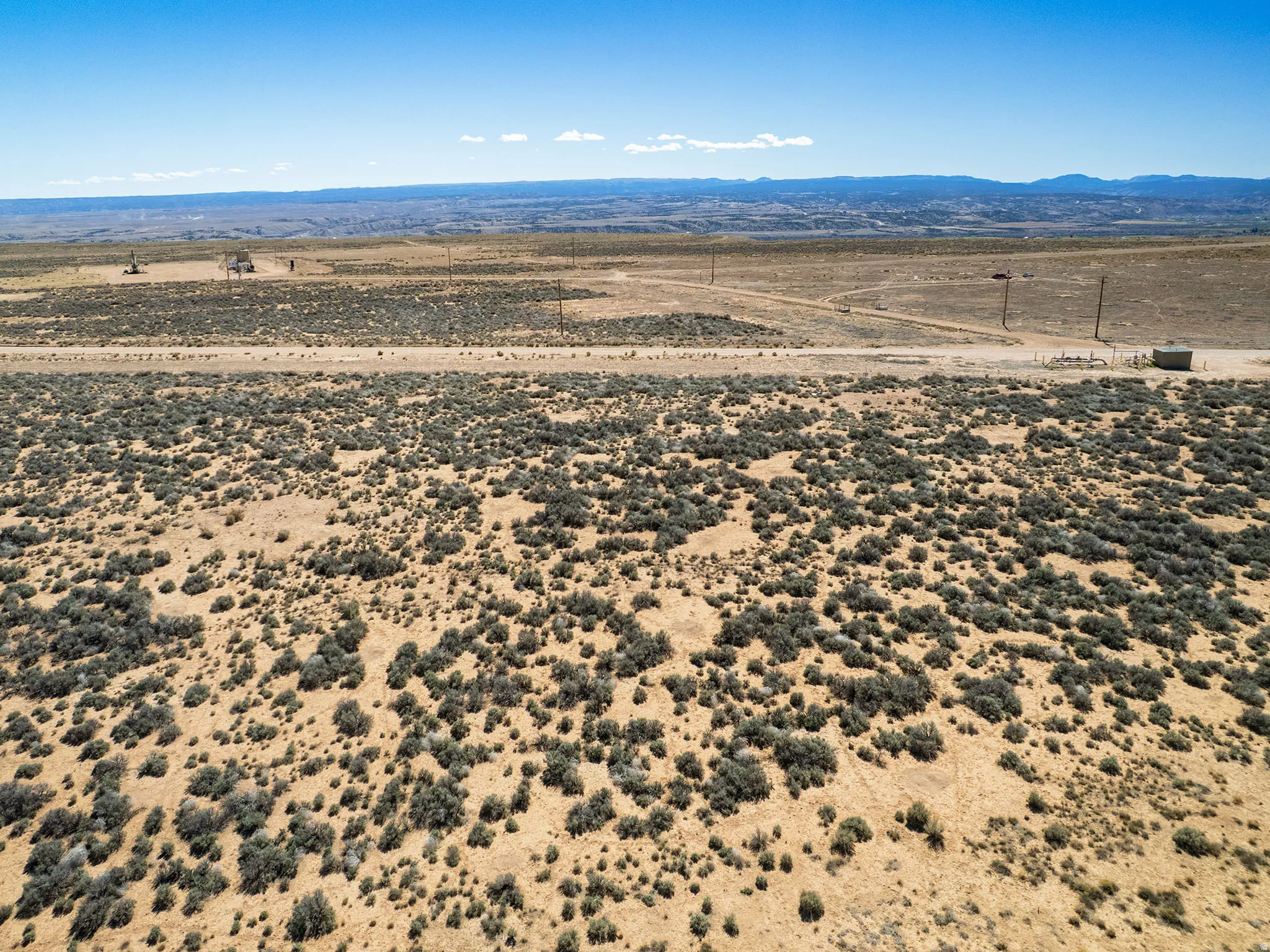 View of rural area with a desert landscape and mountains