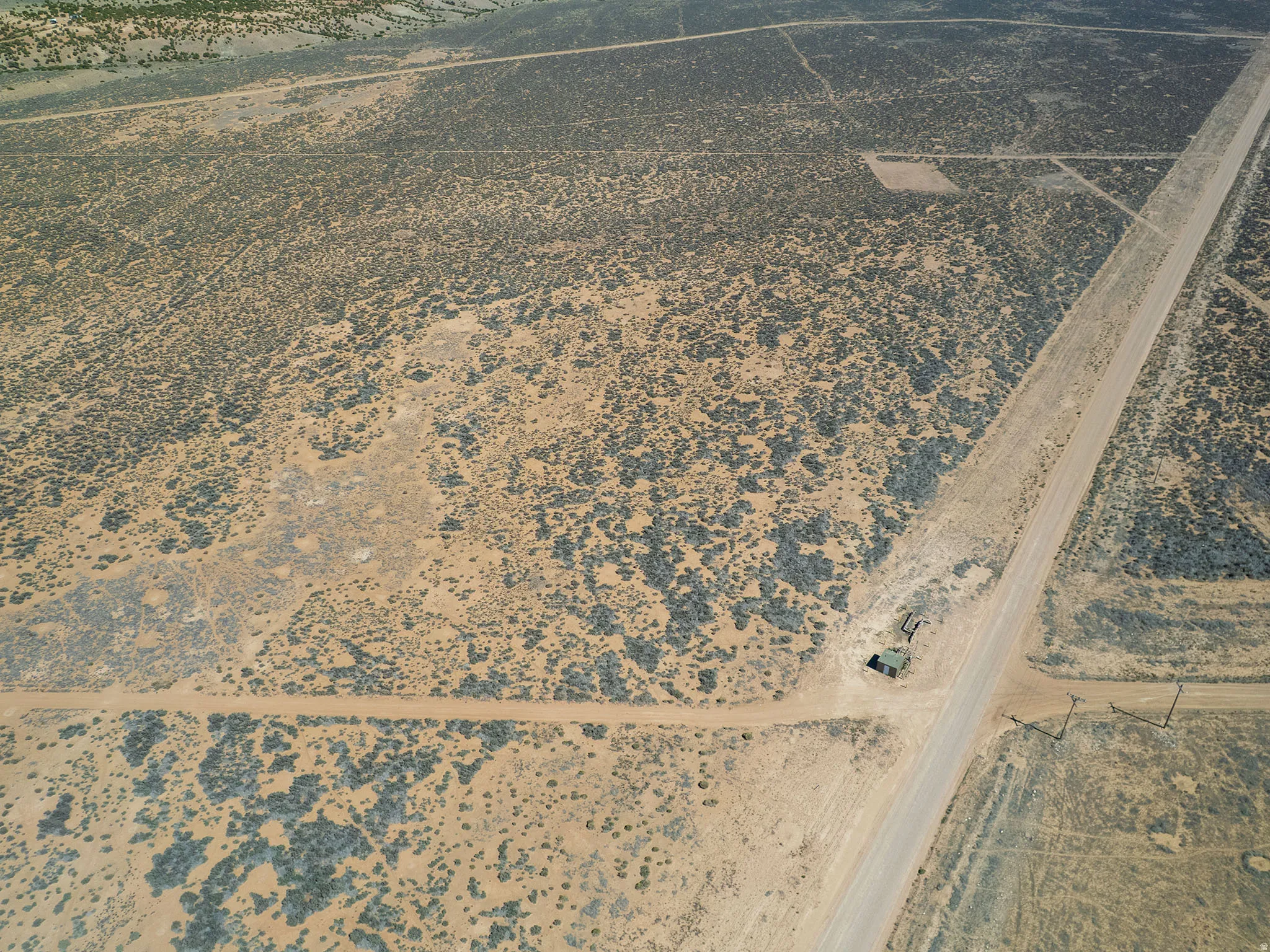 Aerial view of property's location with a desert landscape and rural landscape