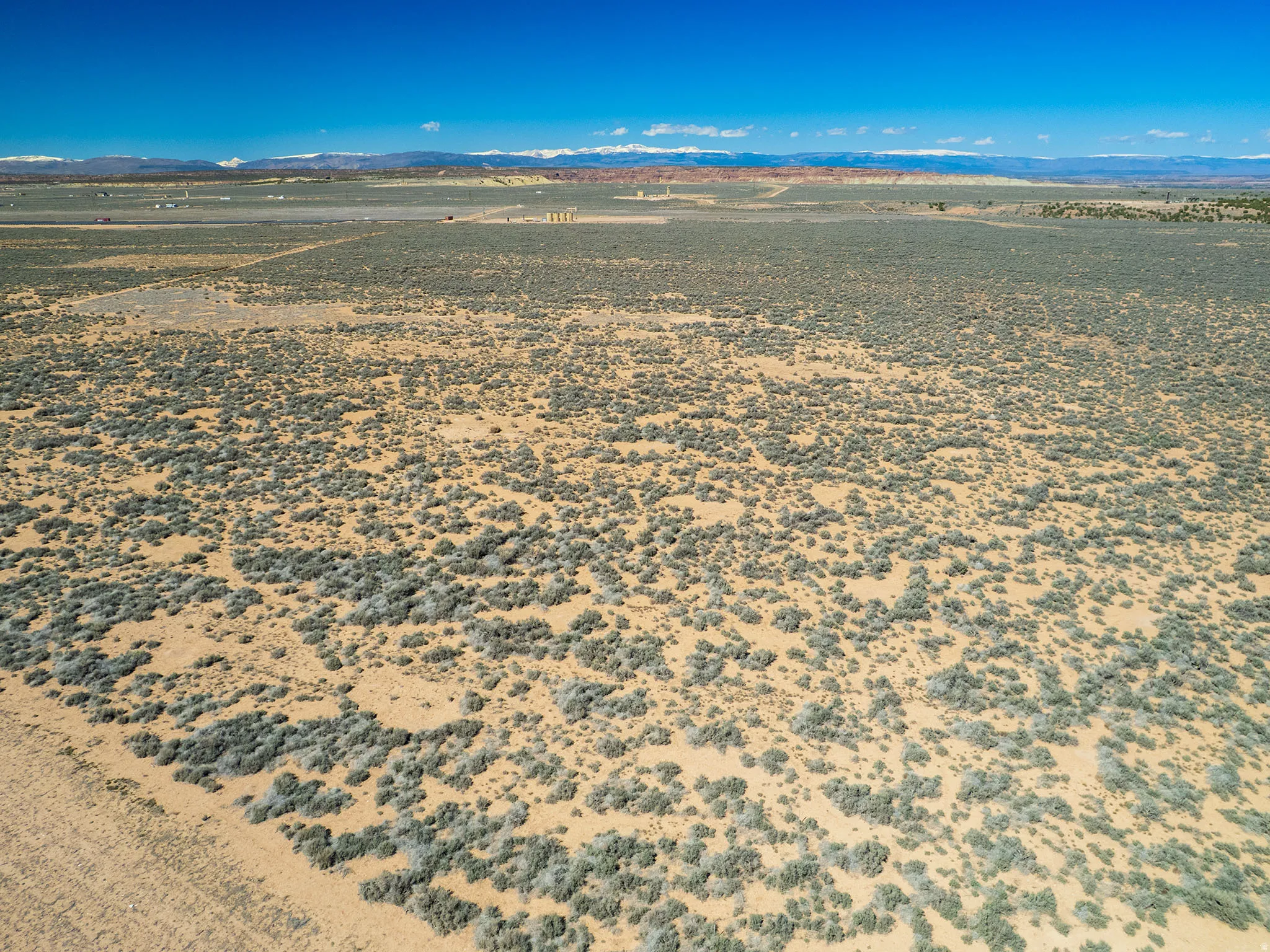 View of rural area featuring a mountainous background and a desert landscape