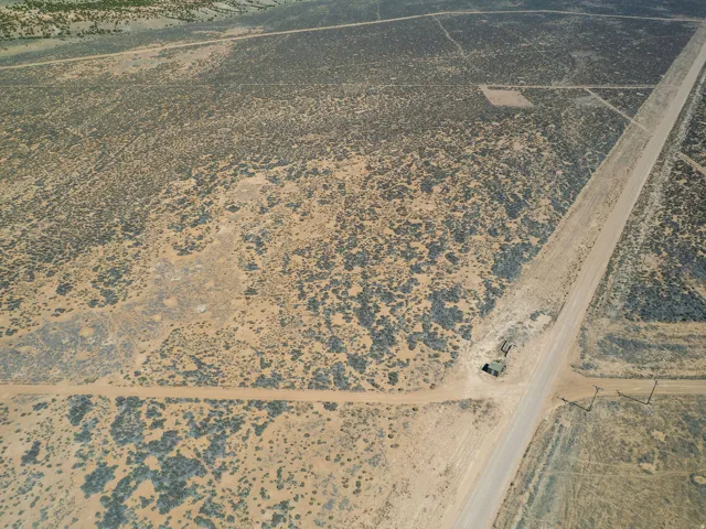 Aerial view of property's location with a desert landscape and rural landscape