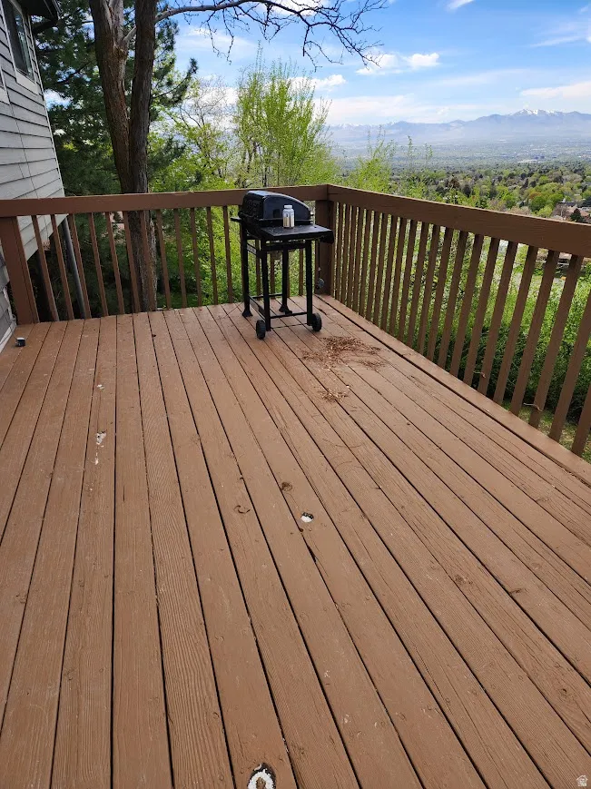 Wooden deck featuring a mountain view
