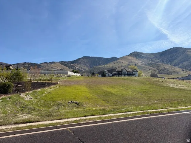 View of mountain background featuring rural landscape