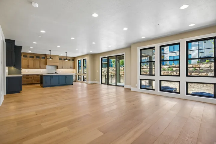 Open-concept living area featuring light wood-finish flooring
