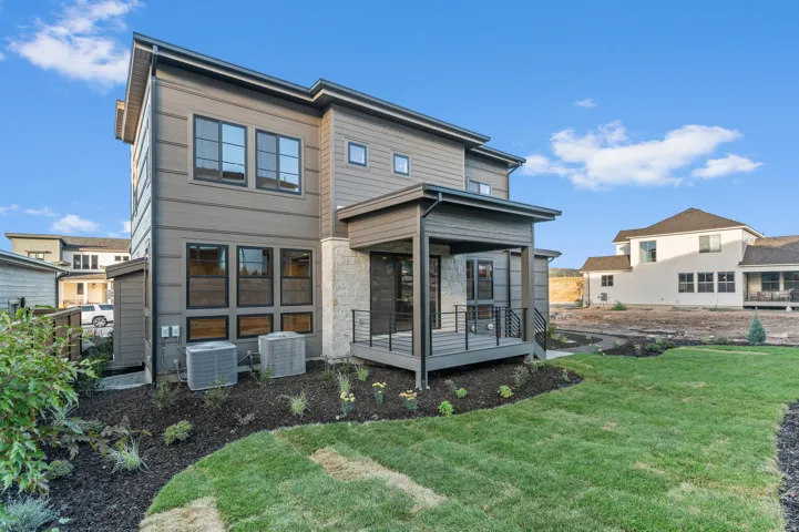 Contemporary exterior with horizontal siding and stone accents