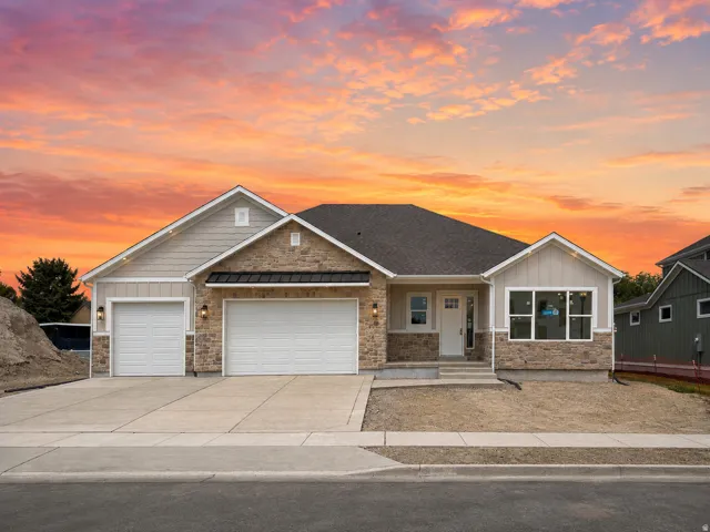 Exterior featuring stone accents, horizontal siding, and a prominent front entry