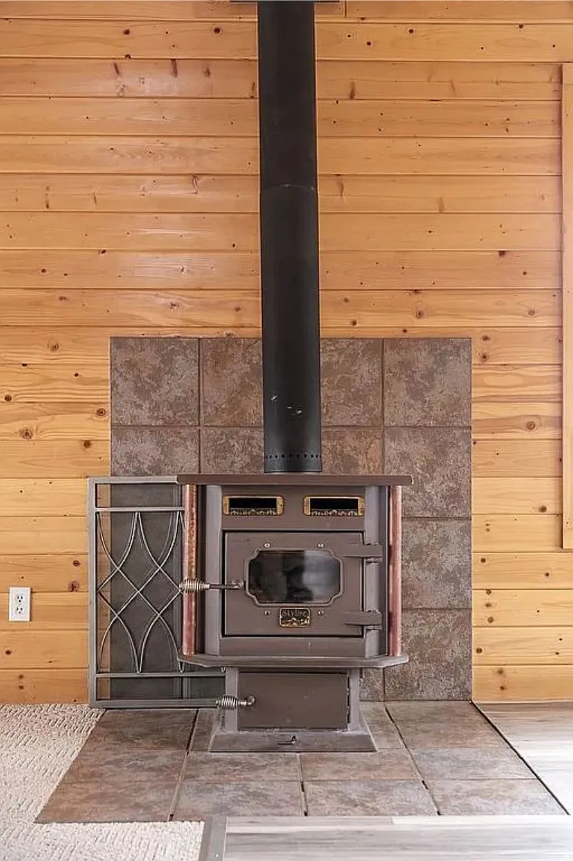 Detailed view of wood walls and a wood stove