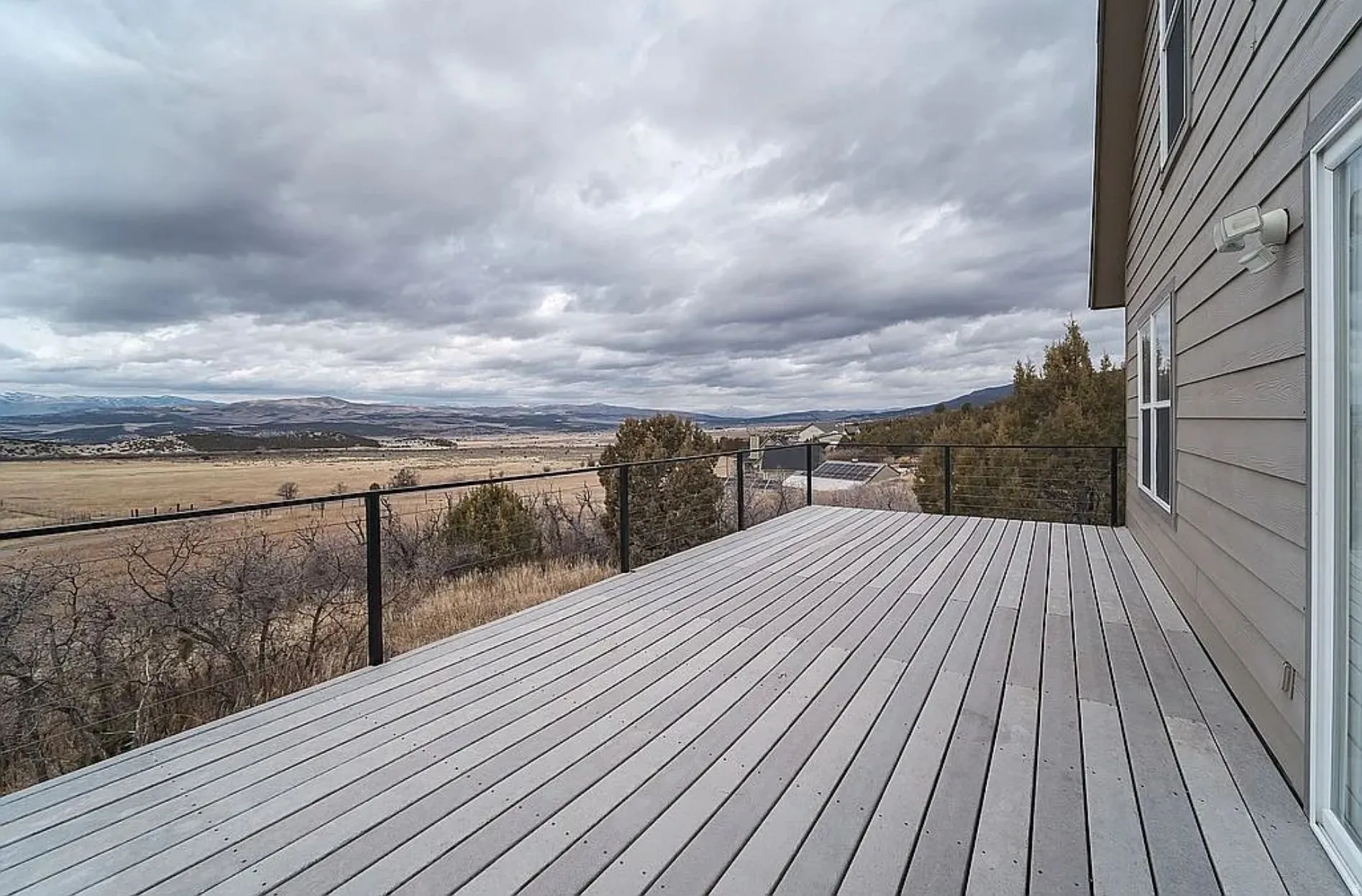 Wooden terrace featuring a mountain view