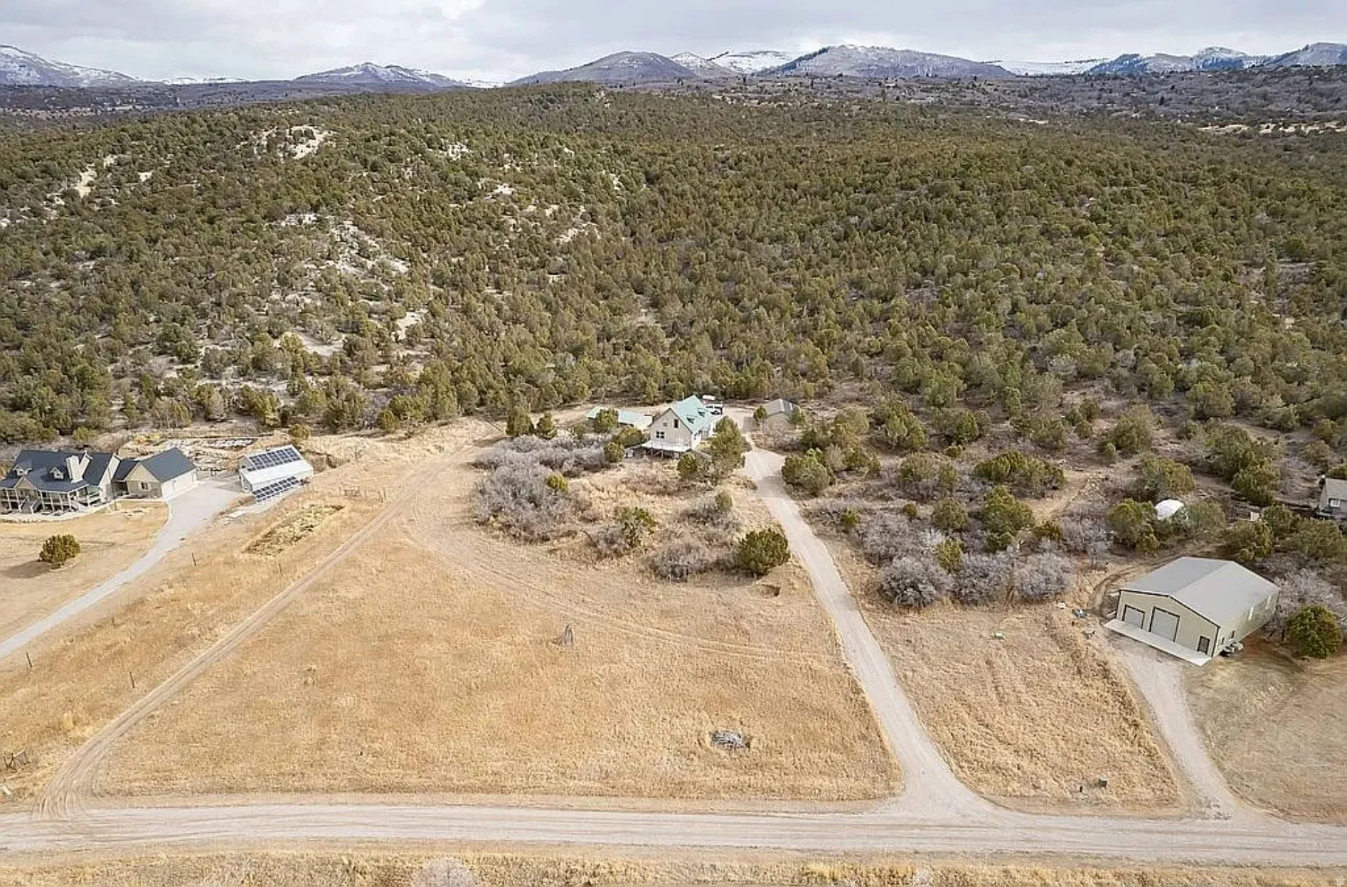 Aerial view of sparsely populated area featuring a mountain backdrop