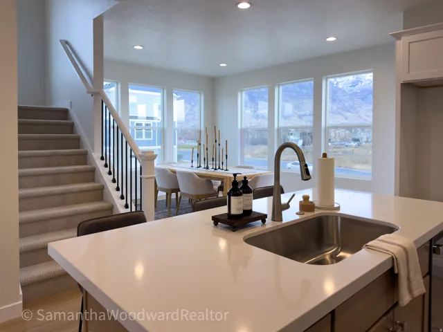 Kitchen featuring recessed lighting, light stone countertops, and light wood-type flooring
