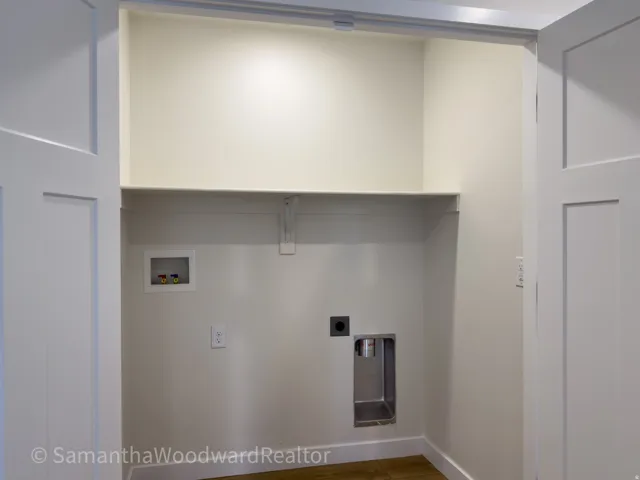 Laundry area featuring hookup for a washing machine, wood finished floors, and electric dryer hookup