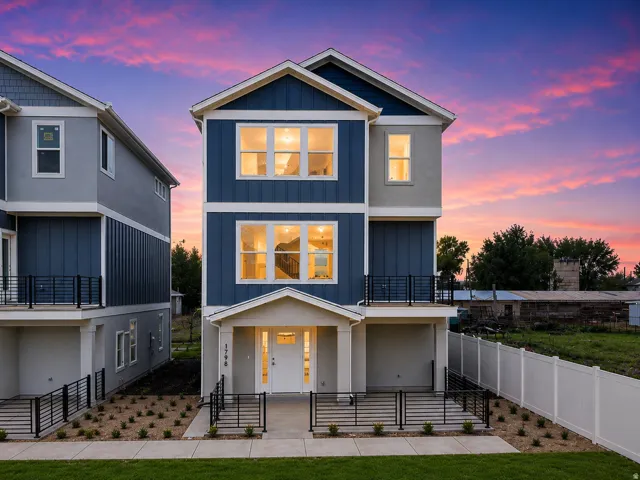 Contemporary multi-story residence featuring a blue and light gray exterior