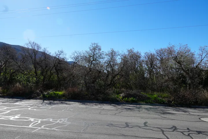 View of asphalt street with a mountain view