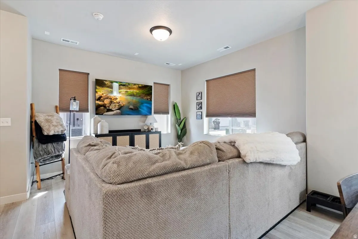 Living room with light wood-type flooring