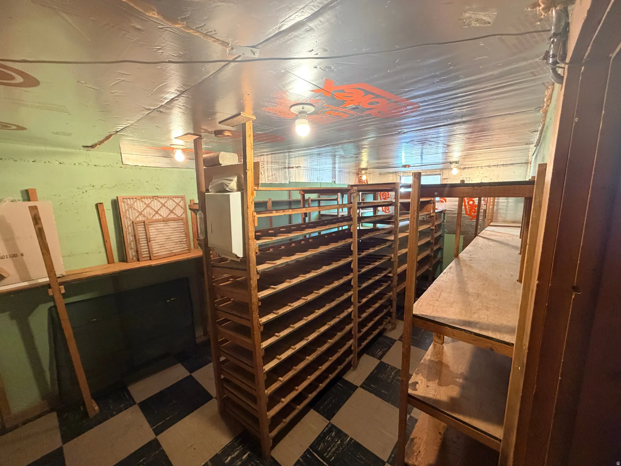 Wine room with dark flooring