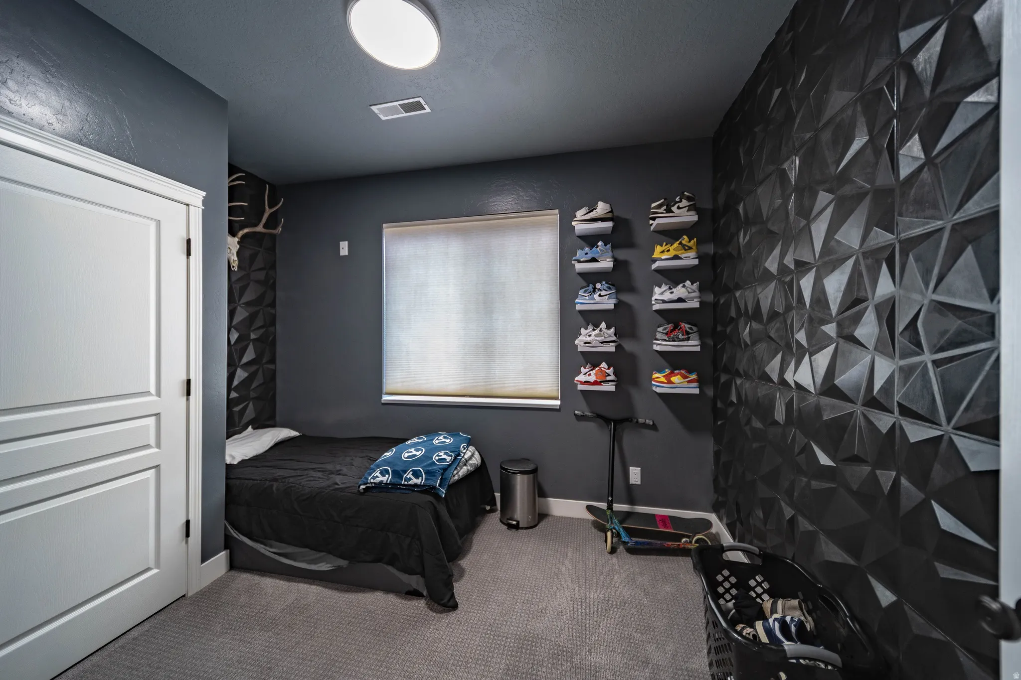 Bedroom featuring light colored carpet and baseboards
