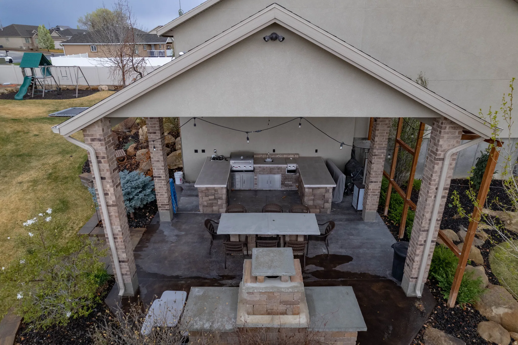 Exterior space with an outdoor kitchen / dining area and a residential view